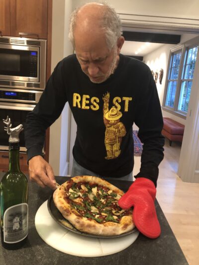 Max Bazerman making pizza