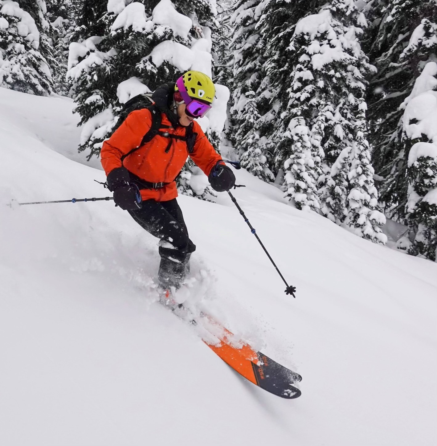 woman skiing down snowy mountain